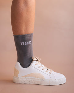 white trainers sustainable grey socks NAE