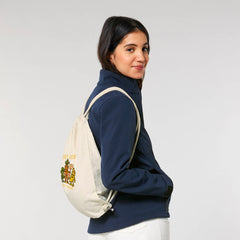 Woman Wearing Vegan Rebel Gym Bag in Beige – Sustainable Drawstring Backpack by NEW WORLD GUARDIANS