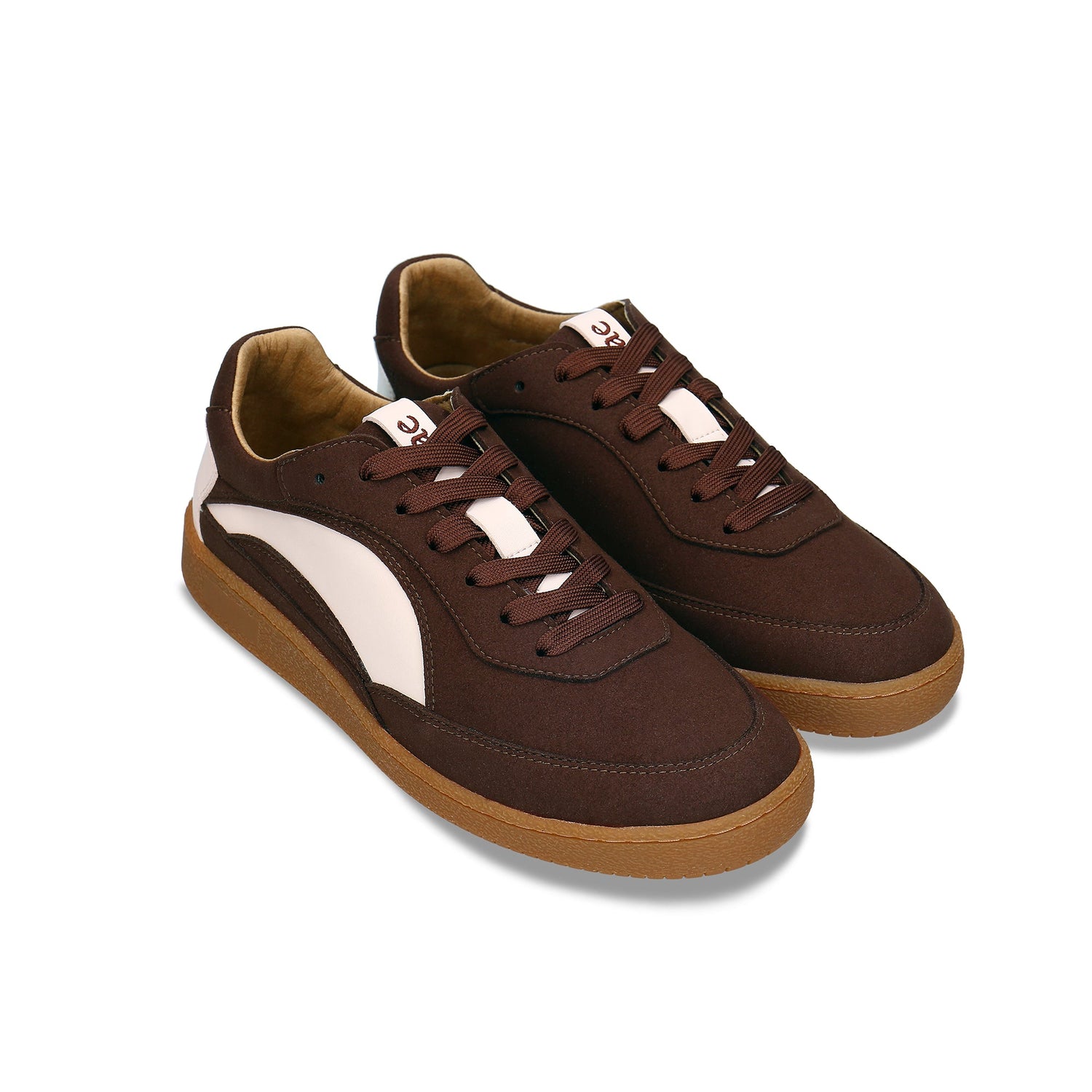 MACKAY Beige vegan unisex sneaker worn by man on steps — dark brown and beige retro sneaker made in Portugal