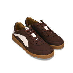 MACKAY Beige vegan unisex sneaker worn by man on steps — dark brown and beige retro sneaker made in Portugal