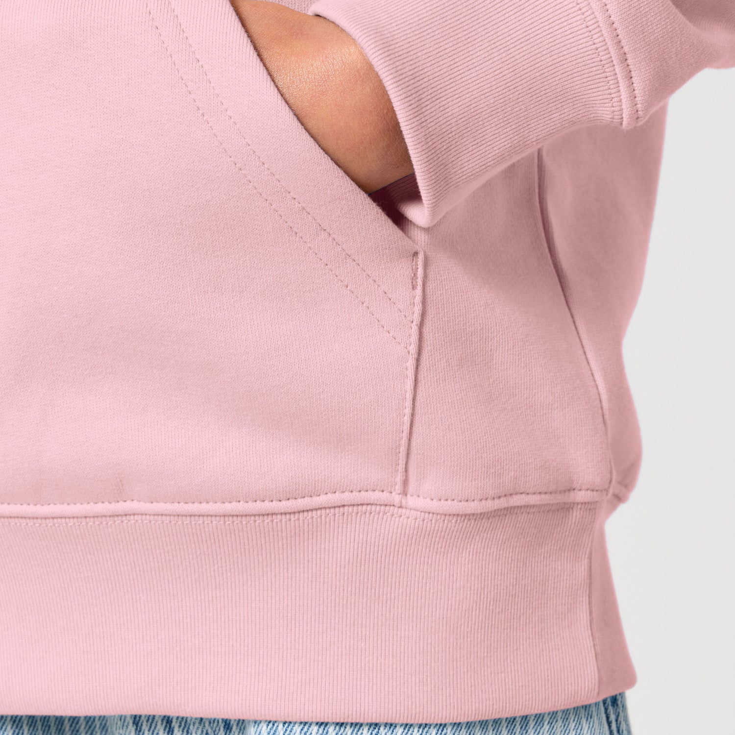 Close-up of a pink kids hoodie, sustainable organic cotton, ten colors available