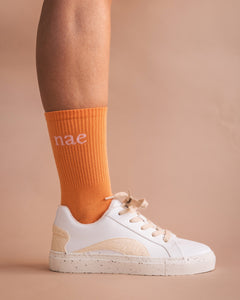 orange soc organic cotton with white trainers NAE