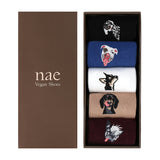 Set of socks with dog illustrations in a box labeled 'nae Vegan Shoes'.