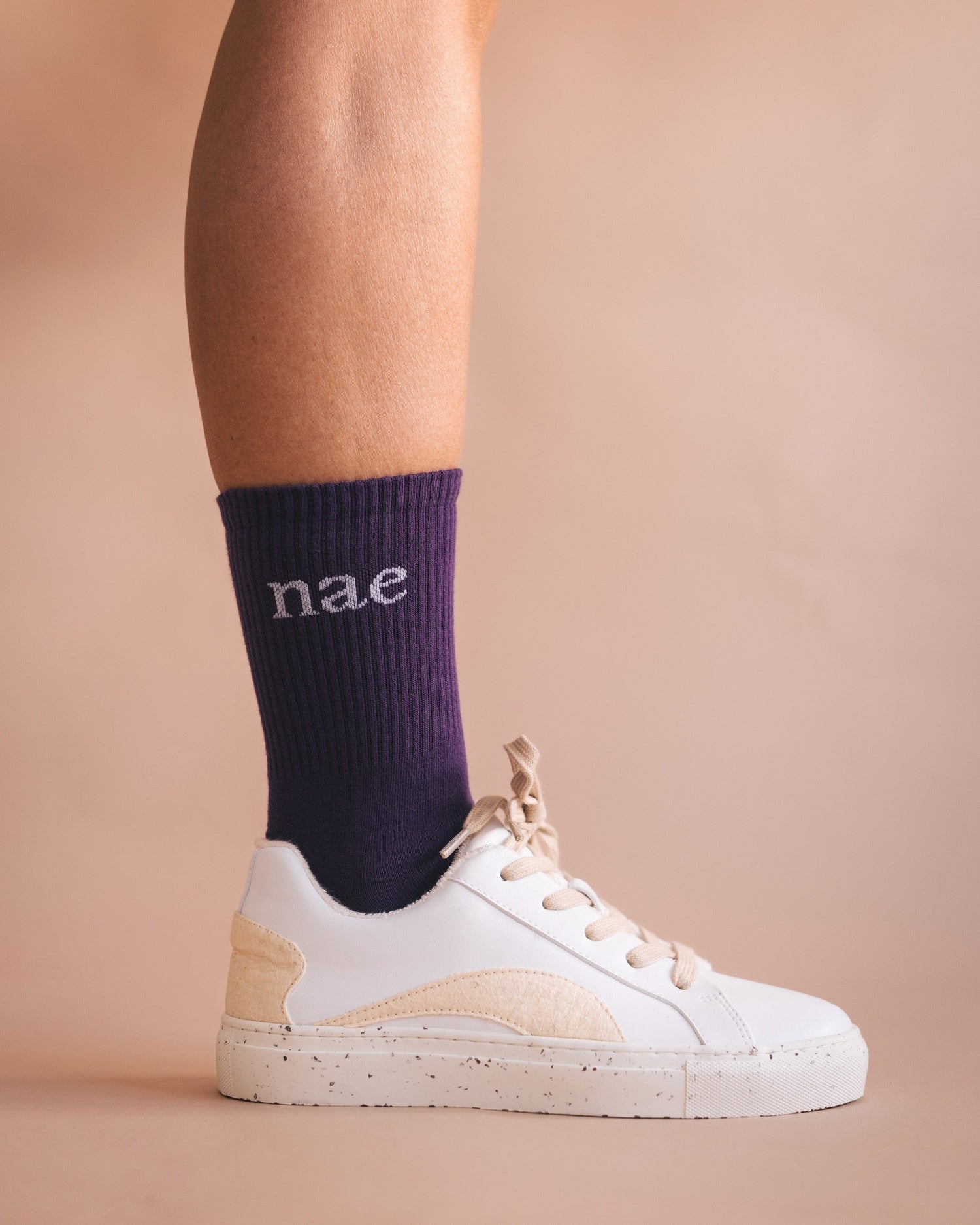 vegan flat white sneakers with purple sock