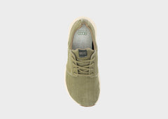 Beige sneaker on a light gray background