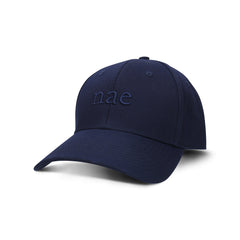 side view of a blue cap made with organic cotton in Portugal by nae vegan shoes