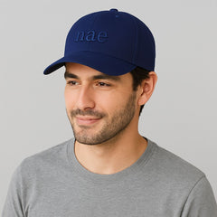 man wearing a blue cap of nae vegan shoes