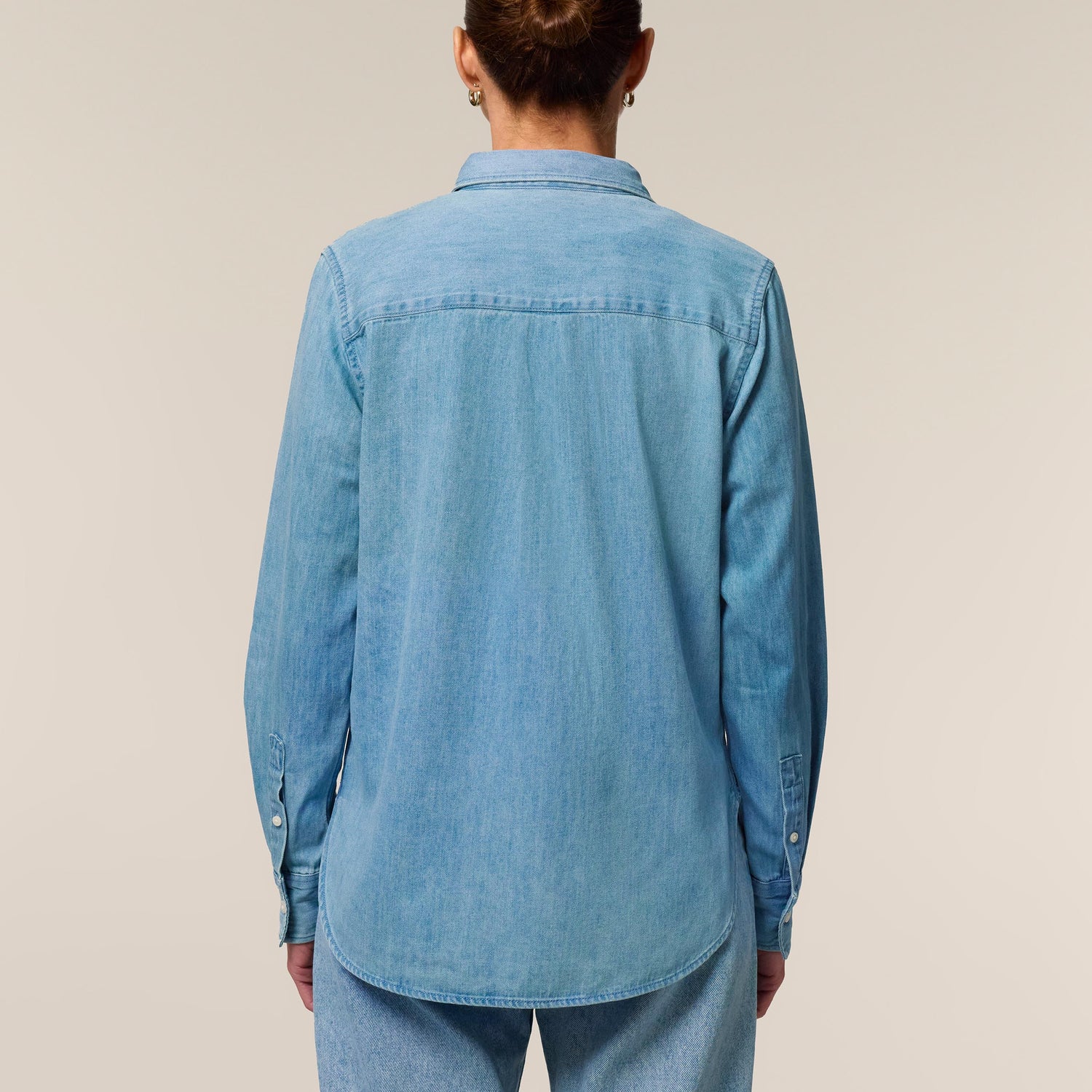 Models wearing the denim shirt for women in light wash – sustainable and ethically made fashion by New World Guardians