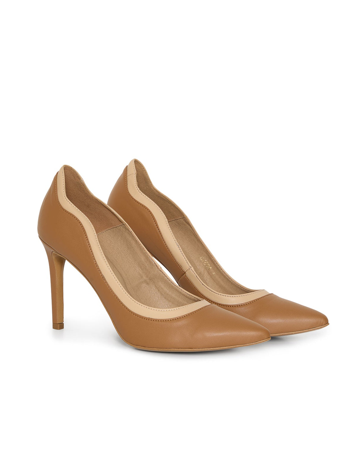 Pair of tan high-heeled shoes made from vegan leather.