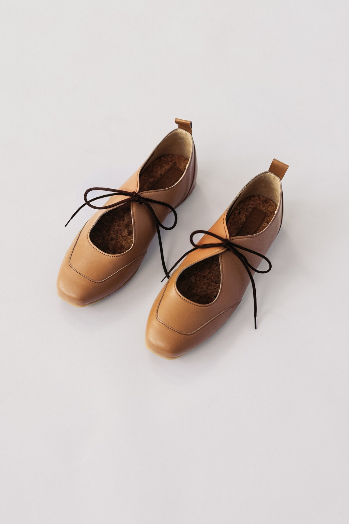 LOUISE (toffee) – vegan ballerina flats made from plant-based leather – styled on a model