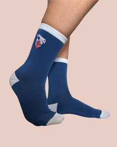 Blue socks with a logo on a beige background
