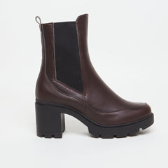 Brown vegan leather boot with a chunky heel on a white background