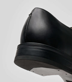 Close-up of the Vegan Monk Strap - Man shoe showcasing the back silhouette and black leather details.