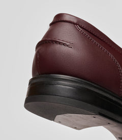 Vegan Loafer - Man showcasing the detailed heel and edge of the shoe, highlighting its stylish design.